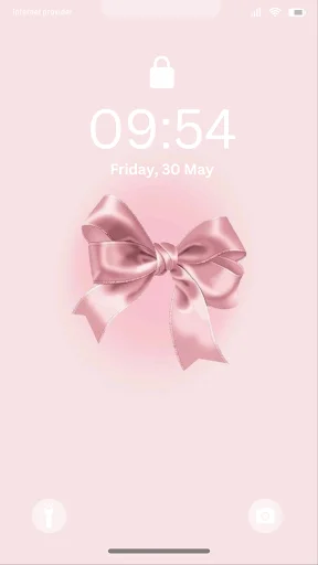 Pink satin bow wallpaper on phone lock screen - cute girly background for personalization