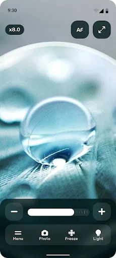 Water droplet detail magnification at 8.0x zoom on fabric demonstrating Perfect Magnifier lighting and zoom features